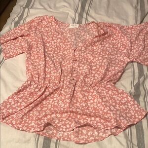 Pink and white floral peplum blouse
